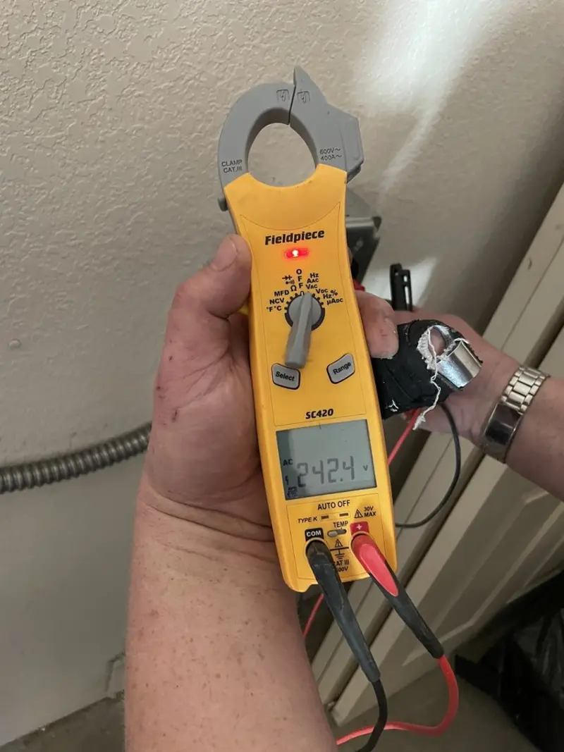 Voltage testing with clamp meter during Generator Installation in Villa Ridge